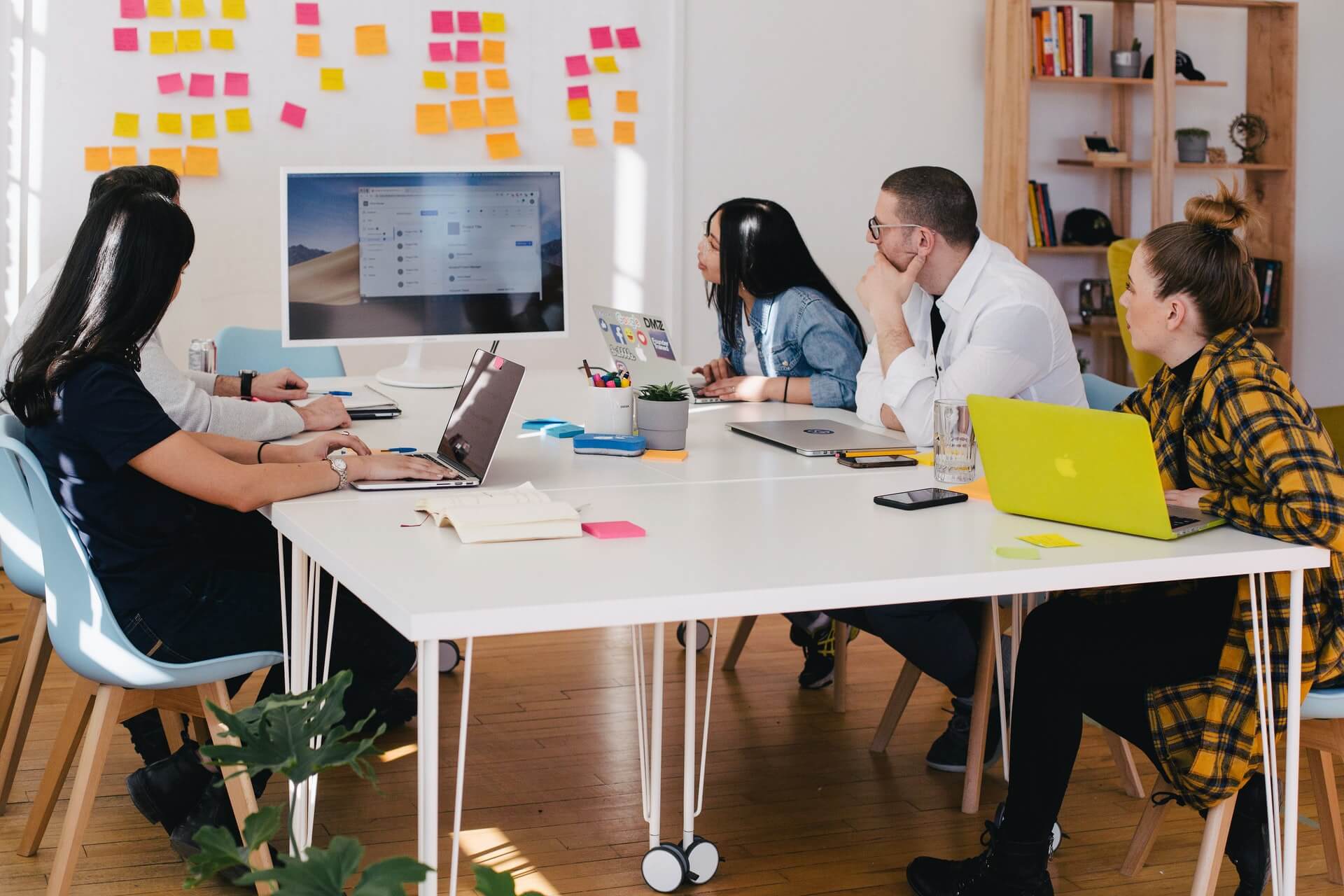 5 people working in an office environment
