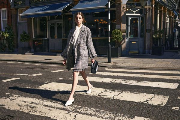 Woman with Zatchels Luna Handmade Leather Handbag Crossing A Road At A Zebra-Crossing