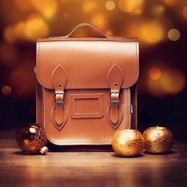 handmade leather backpack in brown on a festive background