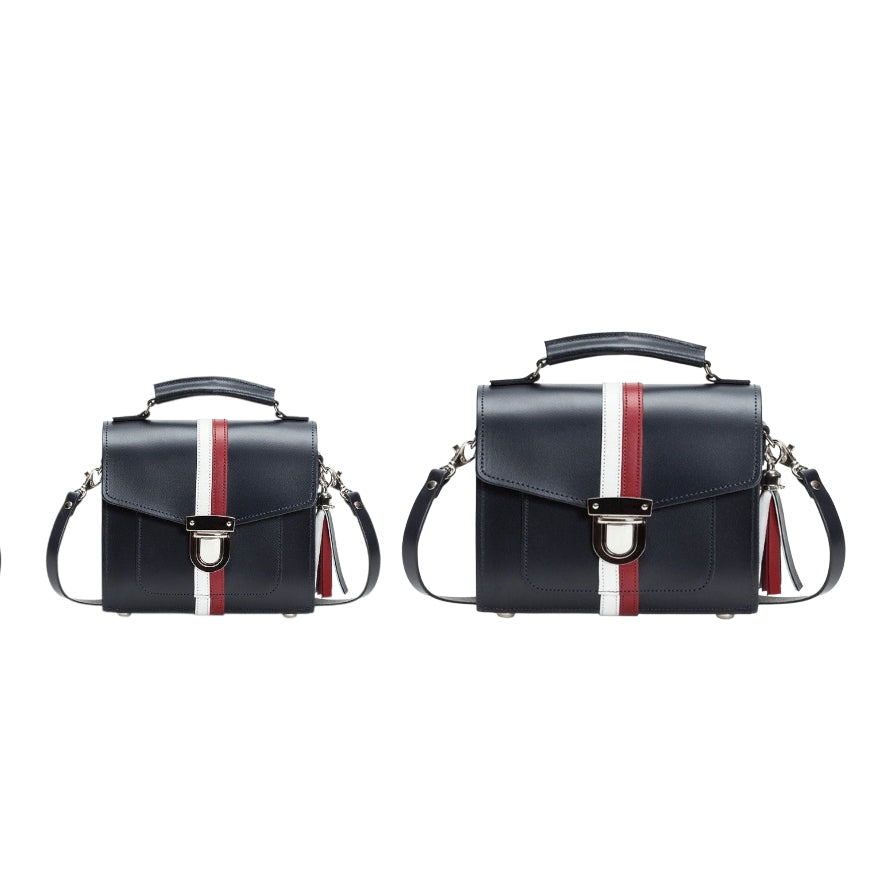 Two Navy Blue handbags with red and white stripes on a white background